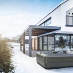 outdoor jacuzzi®️ hot tubs - the J-495 hot tub outside on a snowy day