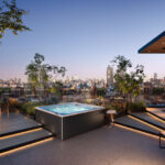 outdoor jacuzzi®️ hot tubs - the J-LXL hot tub with a cityscape in the background