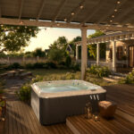 outdoor jacuzzi®️ hot tubs - a J-200 hot tub on a back deck with hanging lights